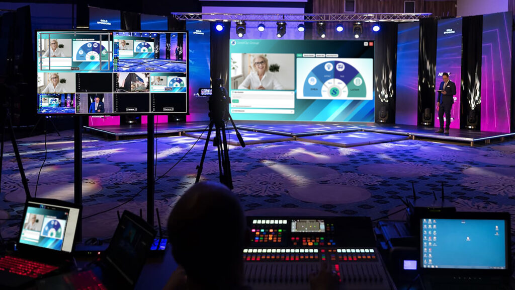 Hybrid event concept with an AV team streaming an on-site event to remote attendees