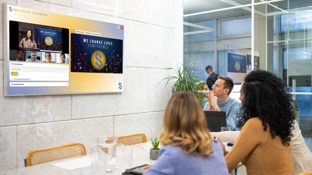 Group of co-workers attending a virtual event from a conference room