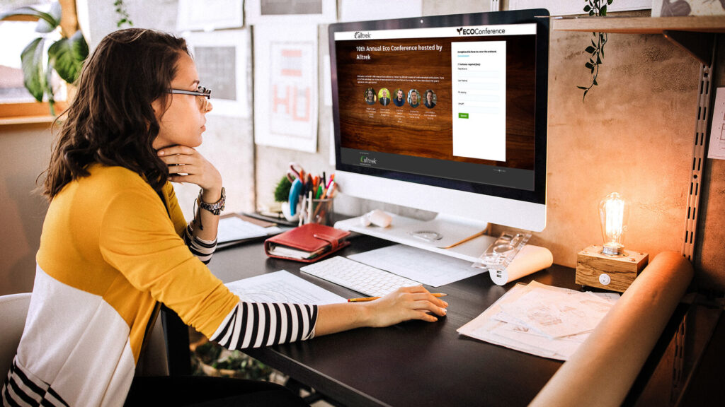 Woman registering for an event on her desktop