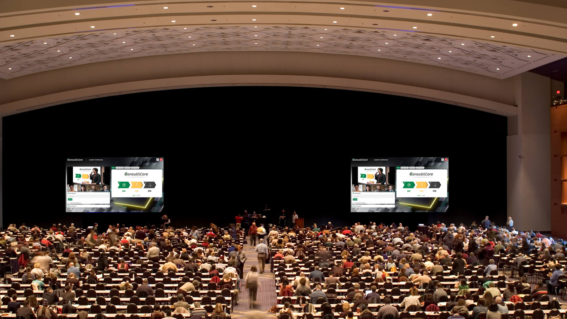 Hybrid Event showing Large Auditorium with with audience looking at screens of the online presentation