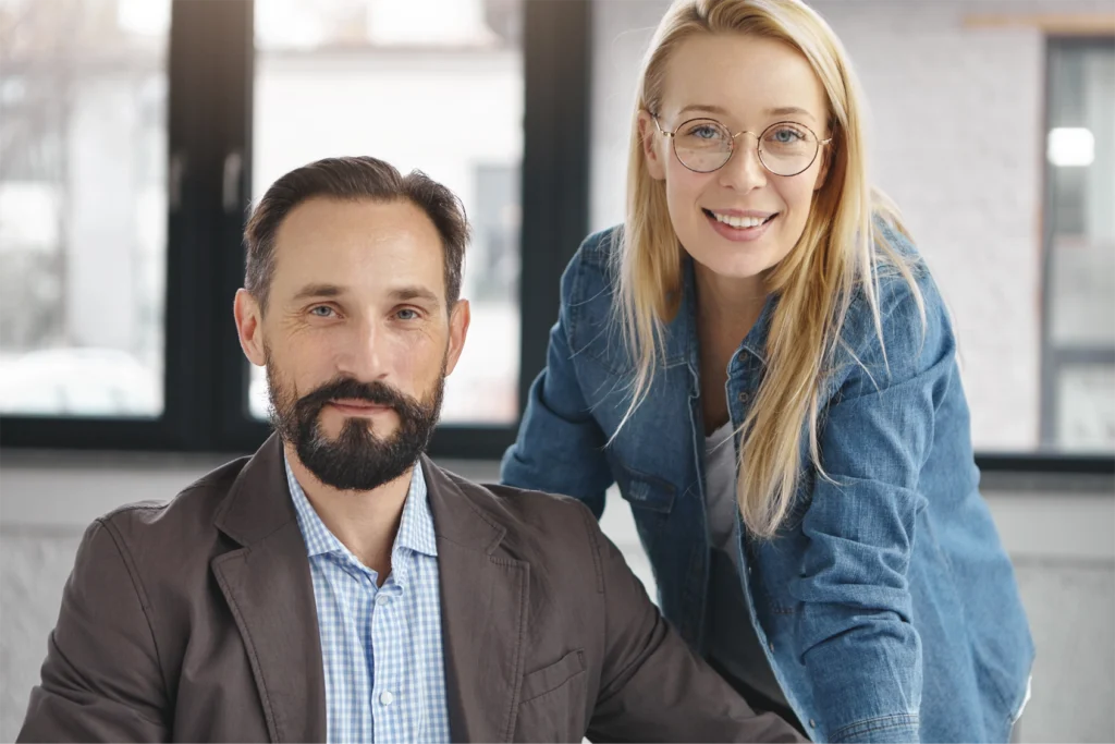 Two smartly dressed business partners presenting on a GlobalMeet Webcast