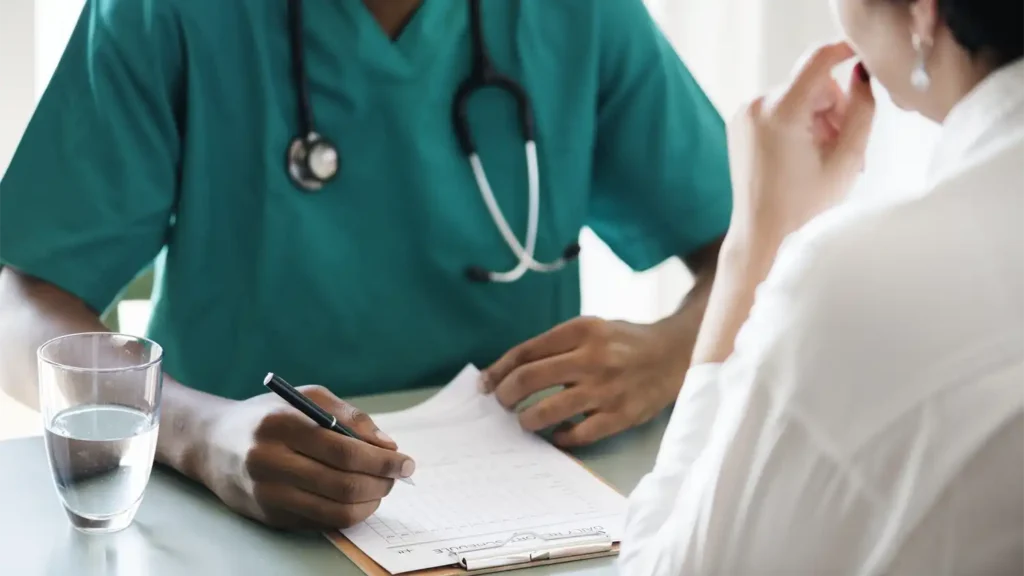 image of a doctor talking to a patient