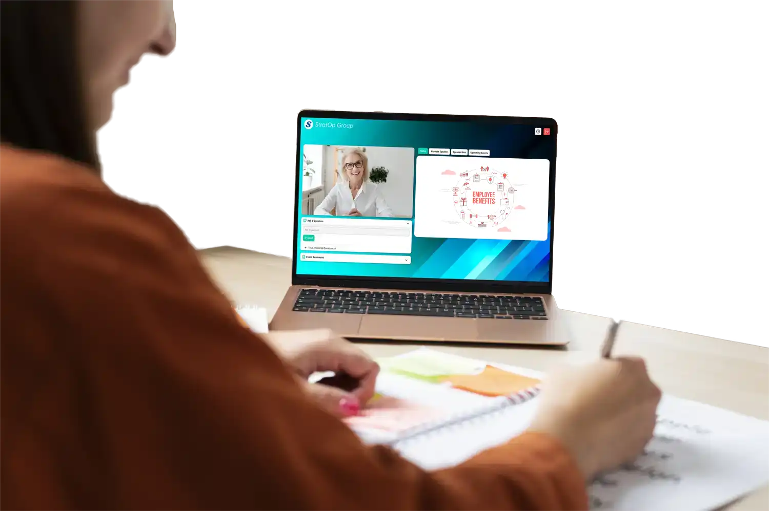 employee takes notes at desk as a hr representative presents their employee benefits communication strategy on globalmeet's virtual event platform