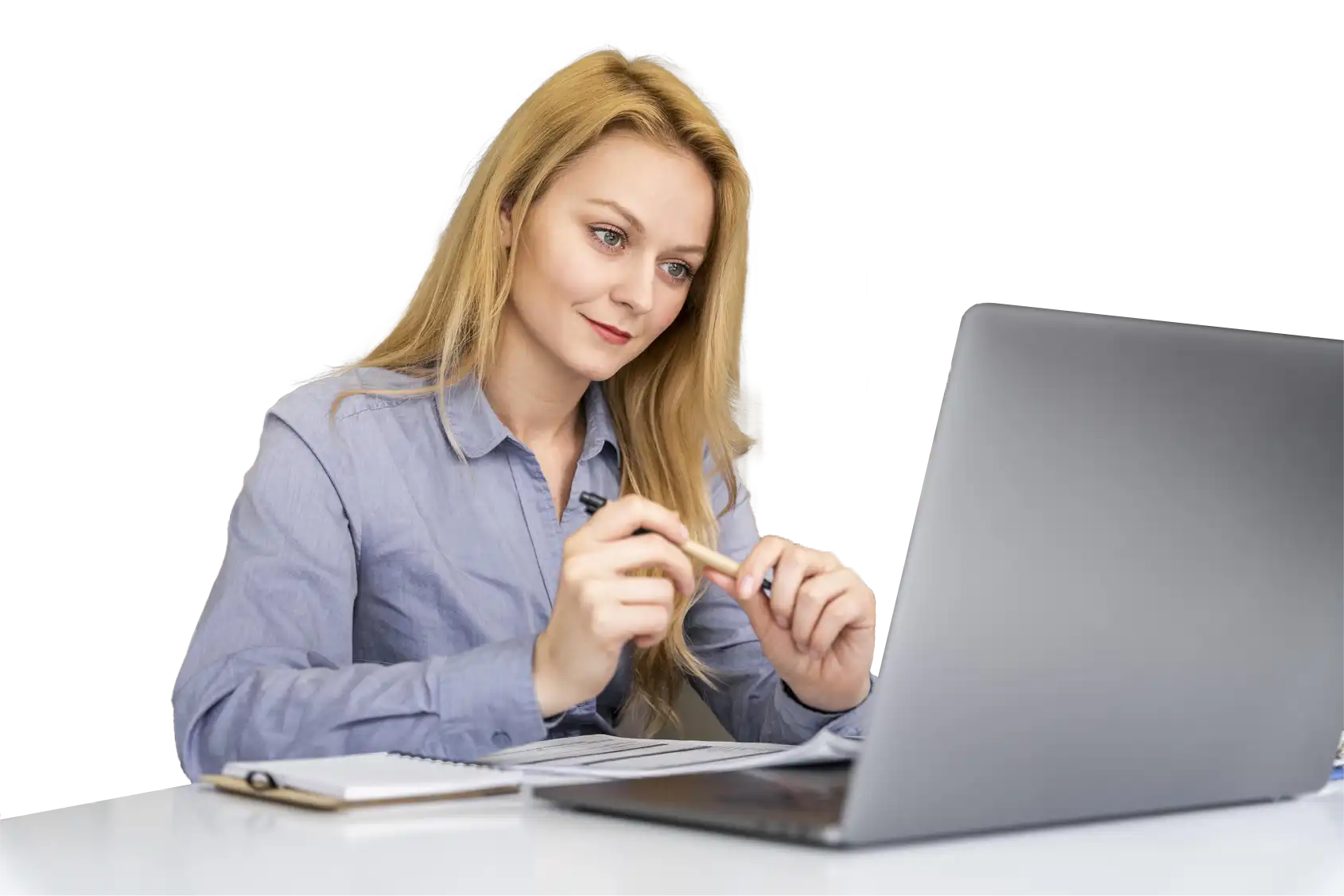 A woman sitting at a dress watching an earnings call webcast on a laptop