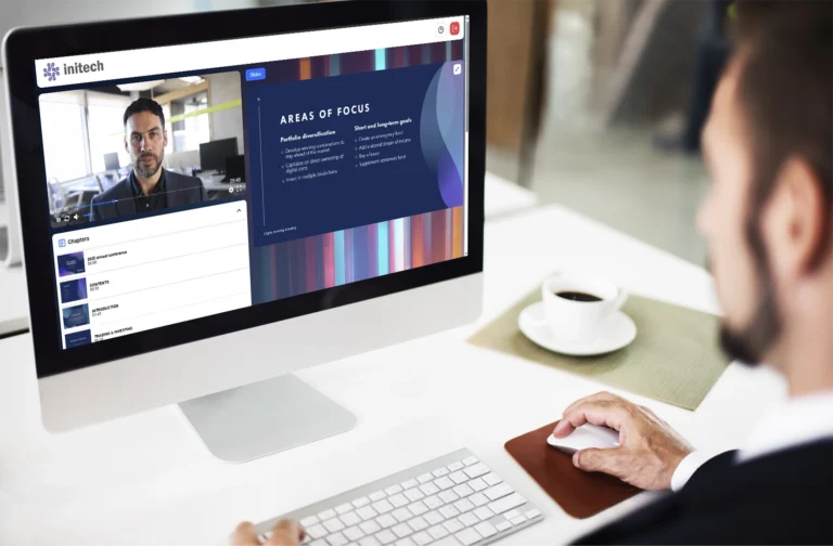 A man sitting at a computer watching a GlobalMeet webcast