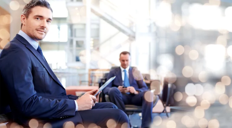 Business man with laptop depicting investor joining globalmeet webcast