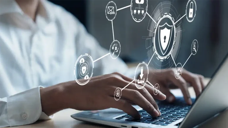 image of woman working at a computer with digital security emblems hovering in front of her illustrating secure communications for change management